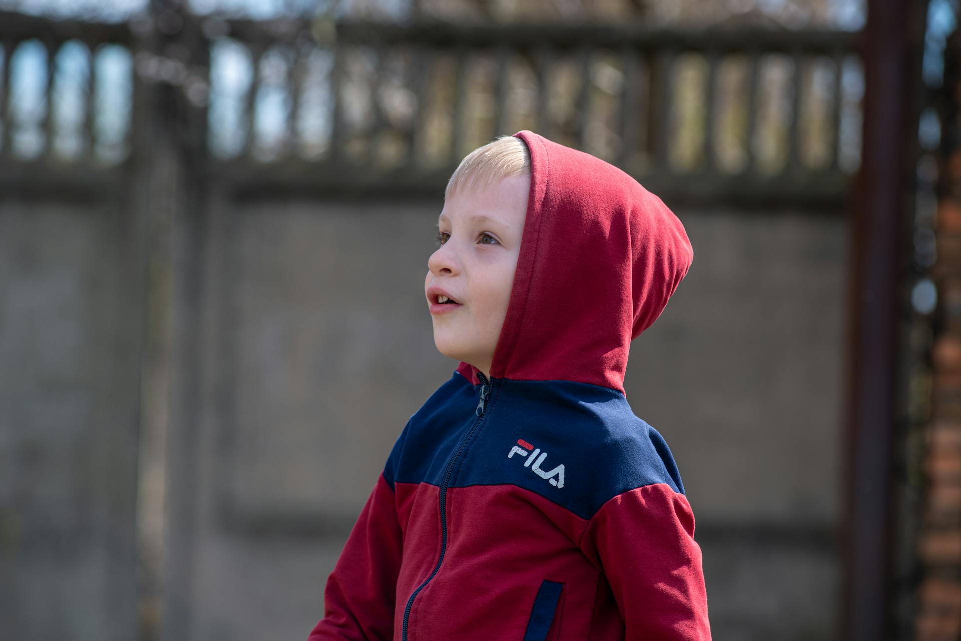 Blond Boy Wearing Fila Hoodie Jacket