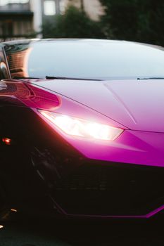 Stunning close-up shot of a purple Lamborghini Huracan showcasing its sleek design and modern elegance.