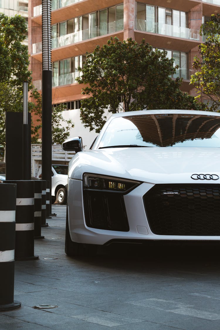 Photo Of The Front Of The White Audi R8 Car On The Street