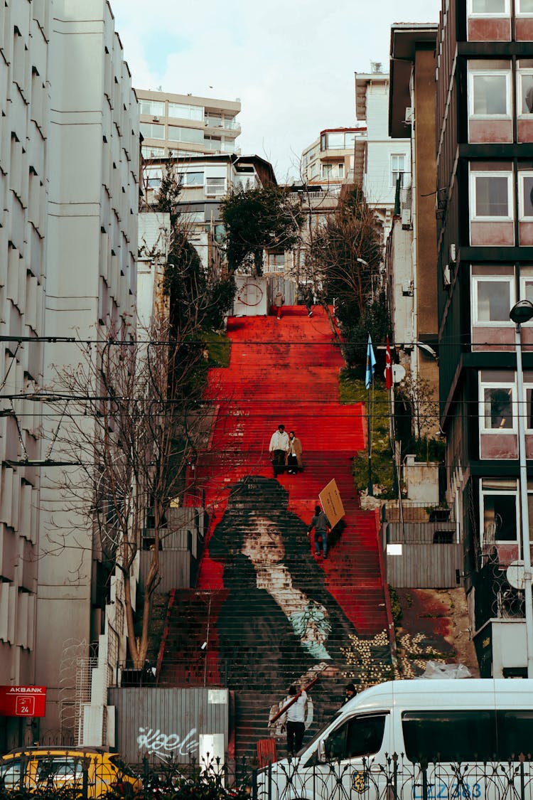 Photo Of A Street Project Of Osman Hamdi Bey Painting Called Woman With Mimosa On The Stairs Of The Beyoglu District, Istanbul, Turkey