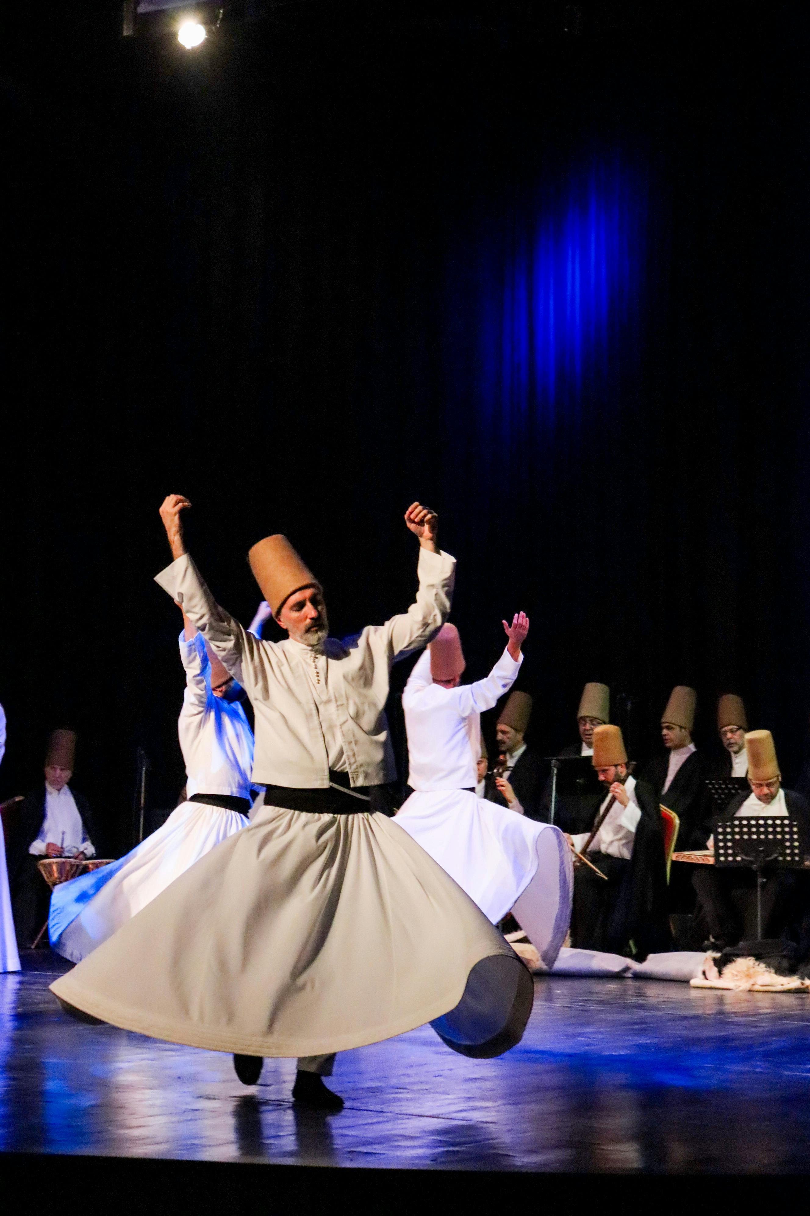 Free Traditional Sufi dancers performing on stage, showcasing cultural heritage. Stock Photo