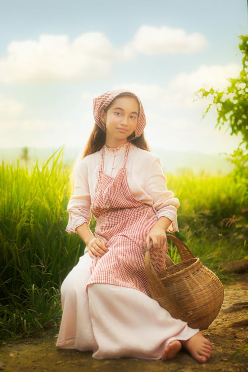 Airbrushed Photo of Woman Sitting in Field