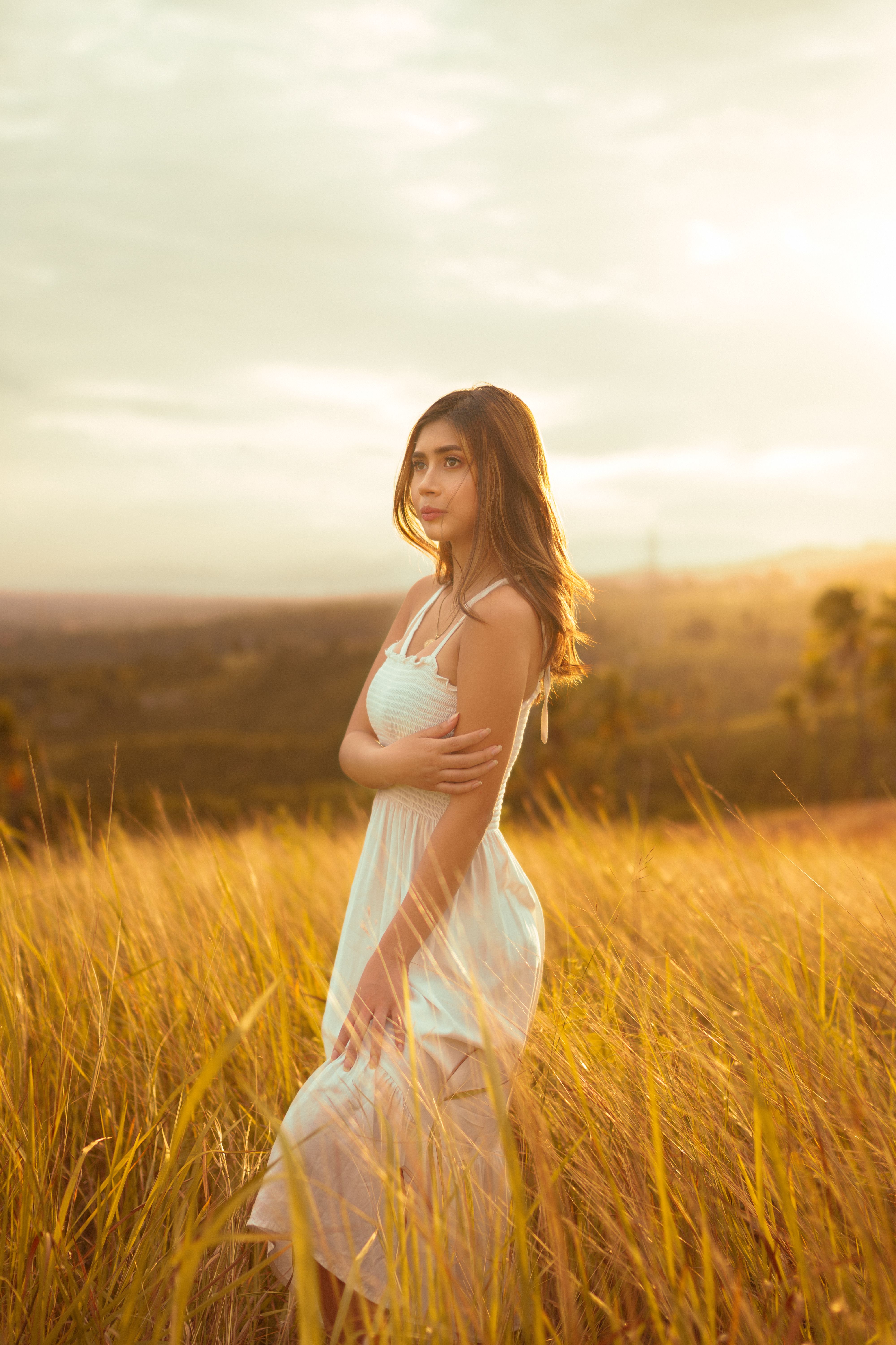 Beautiful Woman Standing in the Middle Grass Field · Free Stock Photo
