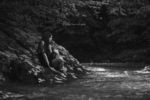 A Woman Sitting Near the River