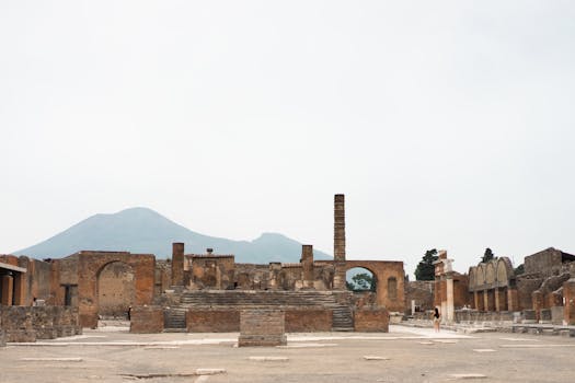 Explore the historic ruins of Pompeii with Mount Vesuvius in the background.