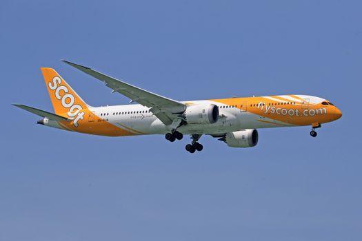 Orange and White Passenger Plane in the Sky