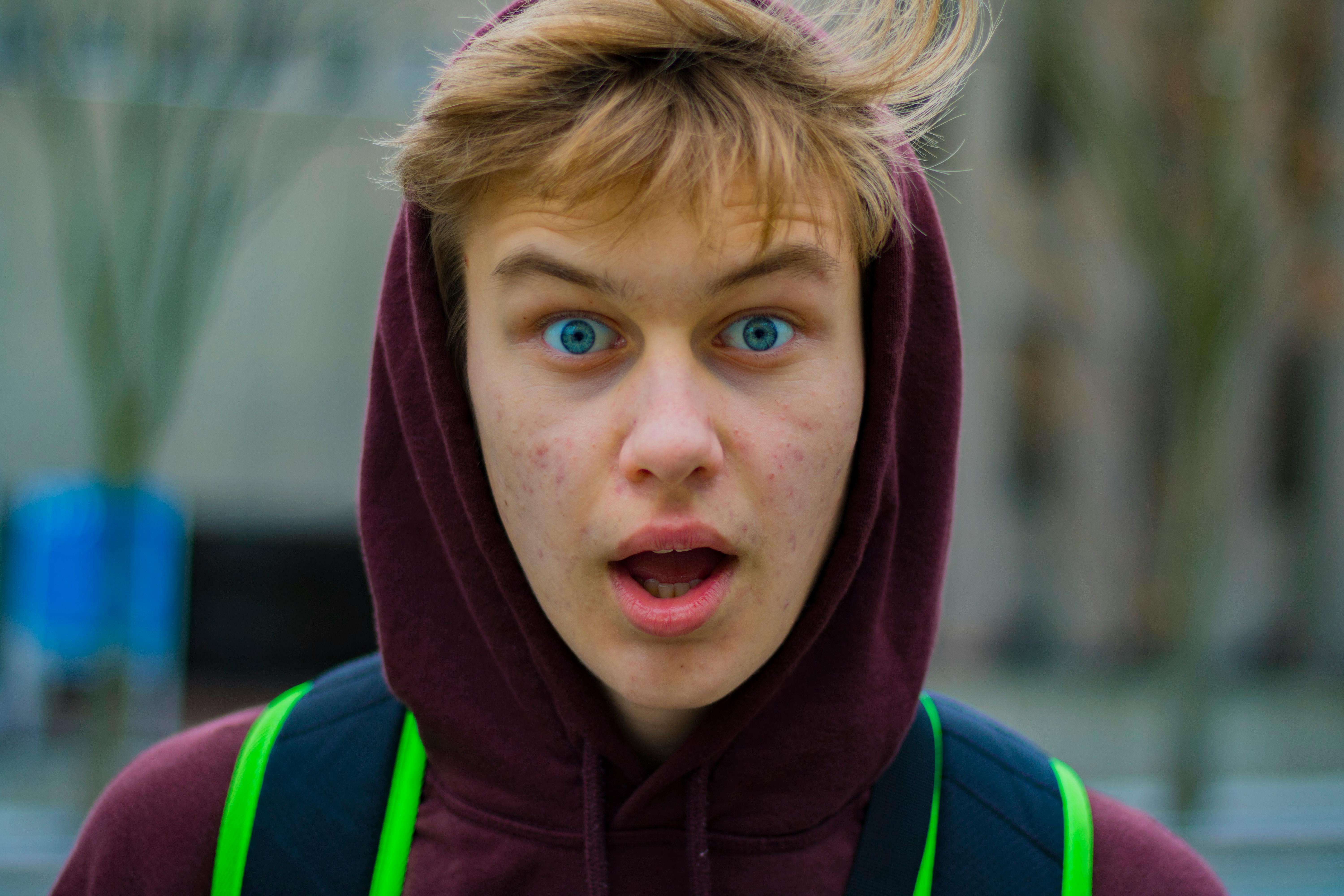 Man Shocked Face Wearing Maroon Hoodie