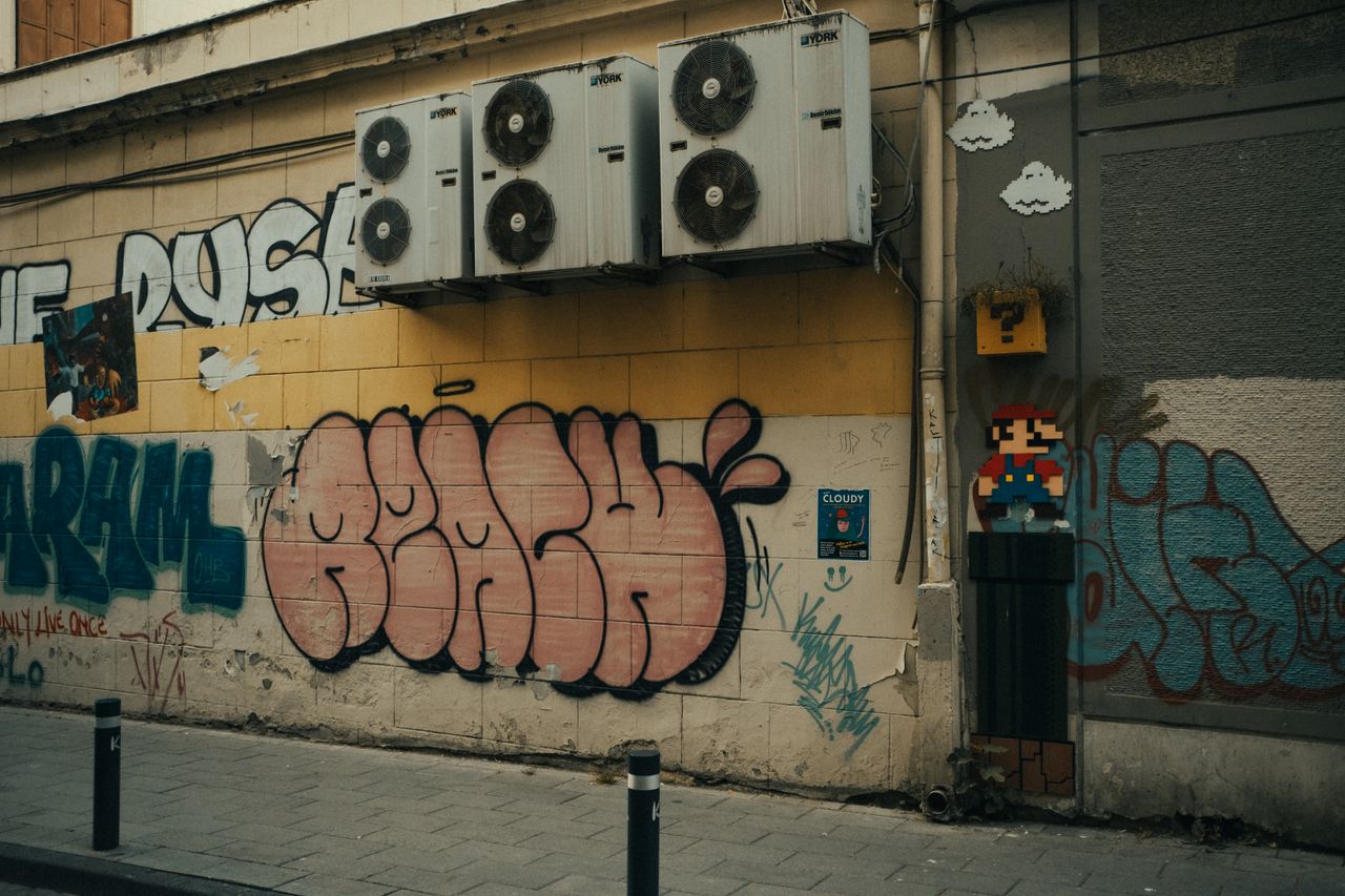 vibrant street art featuring graffiti and pixelated mario on an urban