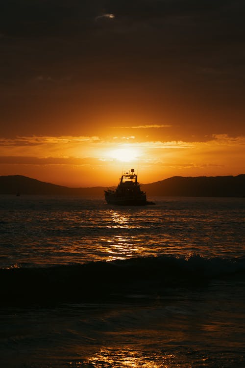 Silhouette of a Boat During Sunset