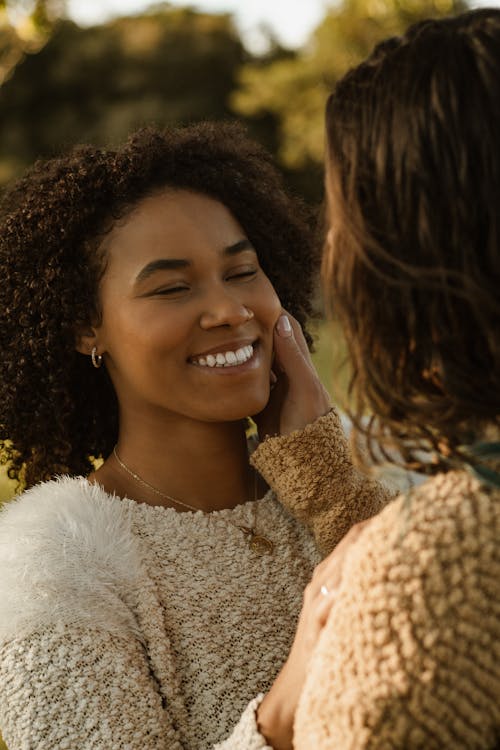 Free Smiling Woman in White Fur Sweater Stock Photo