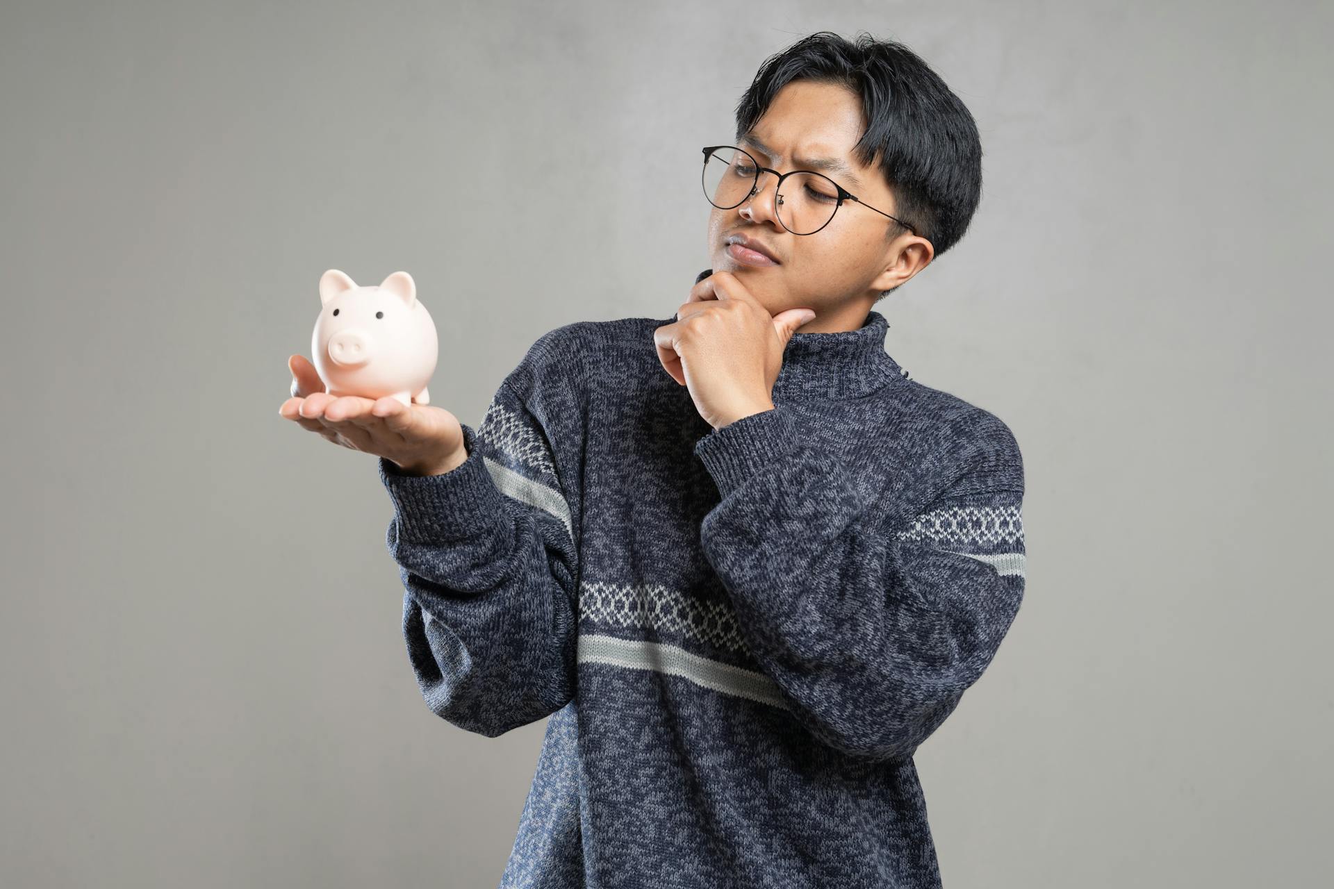 A Man Wearing Eyeglasses Piggy Bank