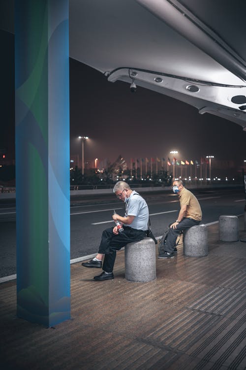 Two Men Waiting in the Bus Stop