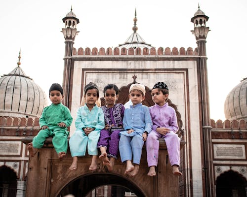 Group of Muslim Kids Sitting in front of the Jama Masjid, Delhi, India 
