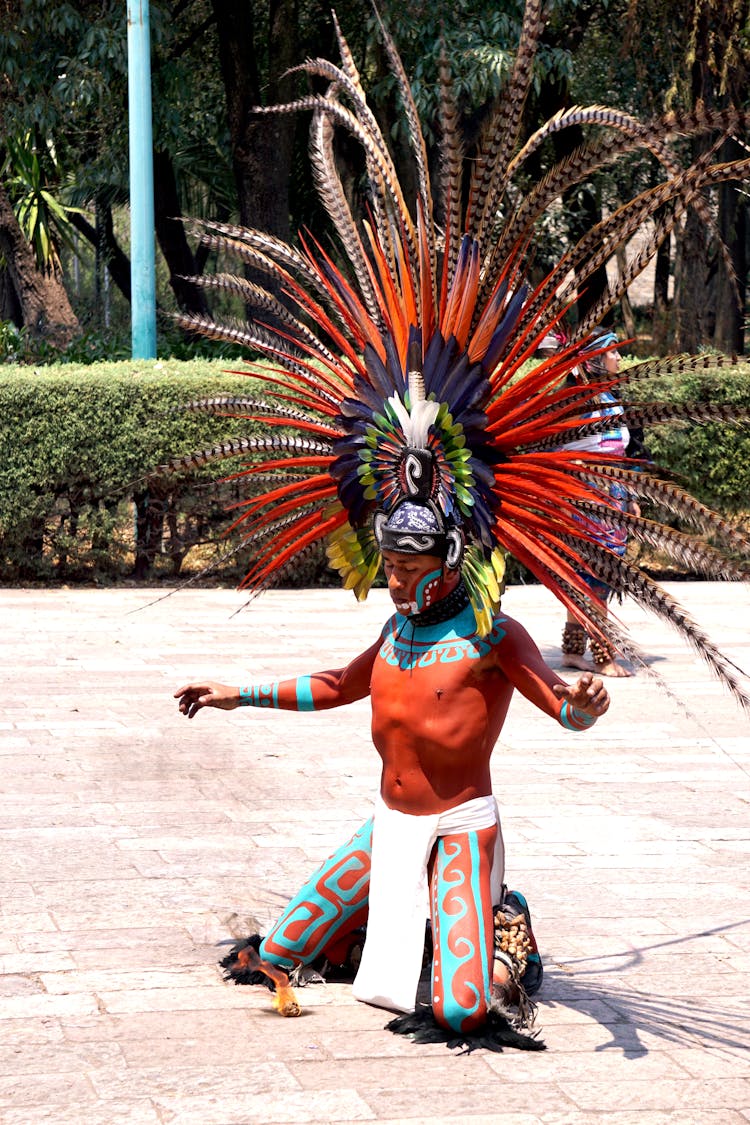 Performer In Tribal Feather Headdress