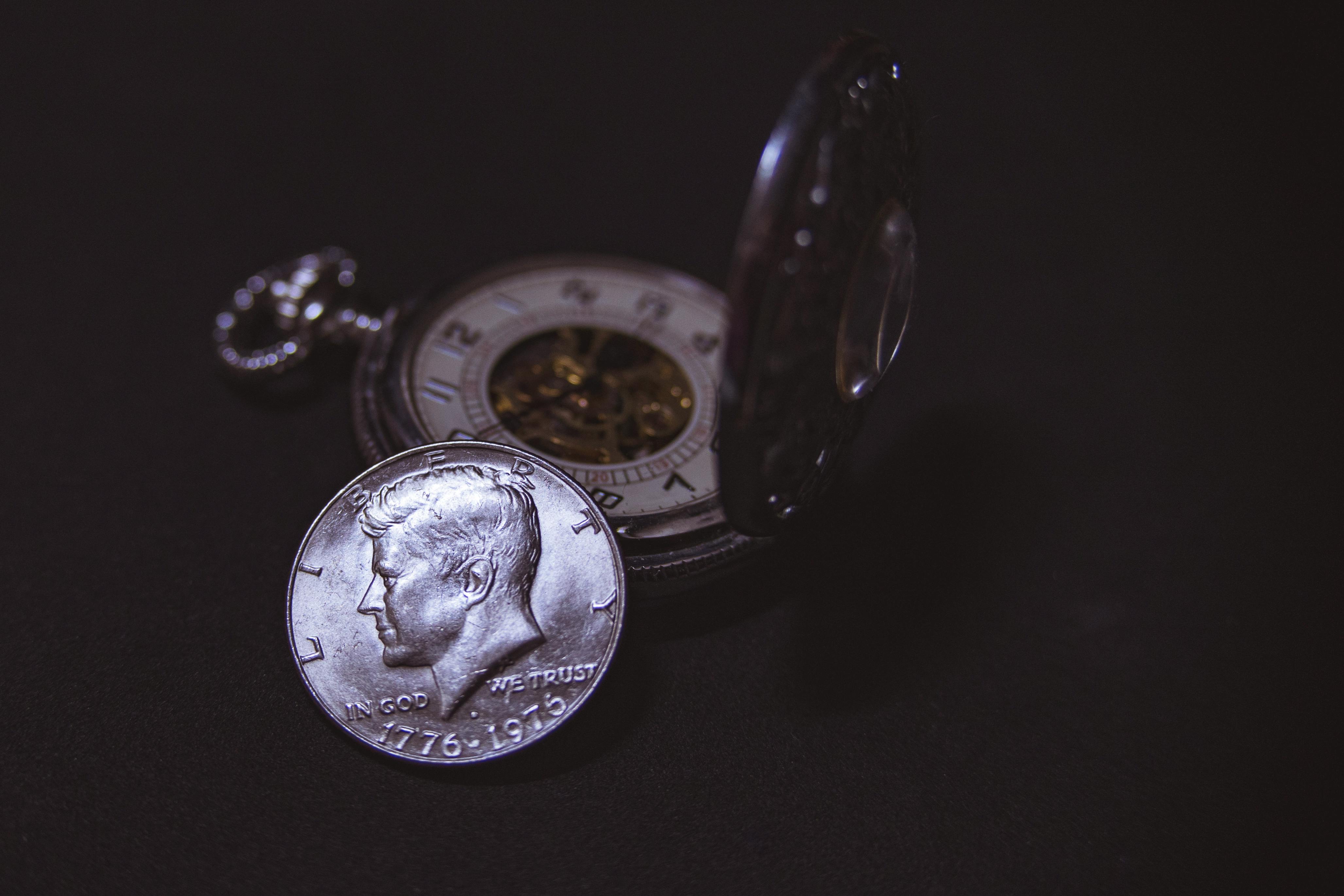 round silver colored liberty coin