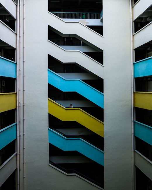 Vertical shot of a vibrant staircase design in a Singapore building.