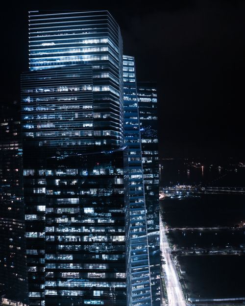 Free A mesmerizing night view of the illuminated skyline in downtown Singapore. Stock Photo