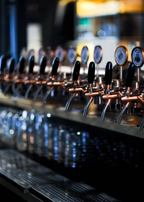 Free A detailed view of multiple beer taps at a stylish bar, showcasing modern design. Stock Photo