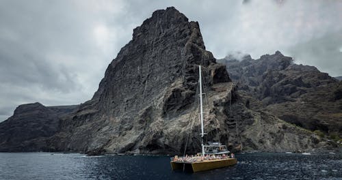 Brown Sailboat near the Rocky Mountain