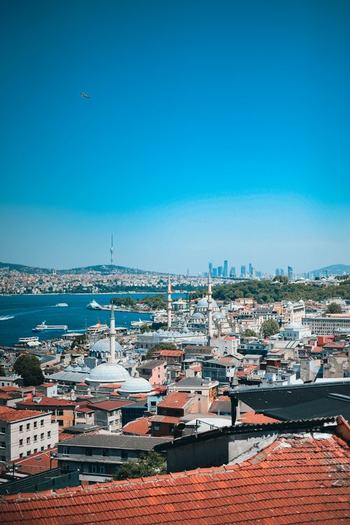 Free Stunning view of Istanbul's urban skyline with mosques and the Bosphorus under a bright blue sky. Stock Photo