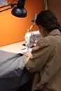Woman Sewing with Sewing Machine