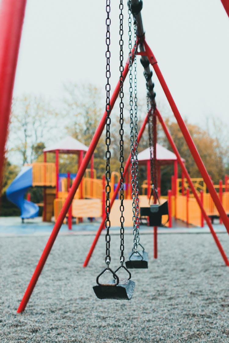 Empty Swings On Playground