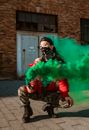 Man in Red Jacket Smoking