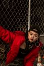 Fence behind Woman