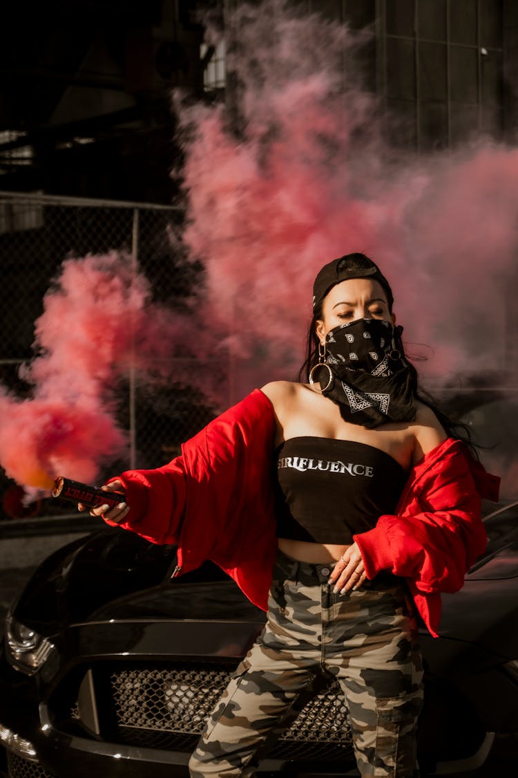 Young Woman Holding Red Flares 