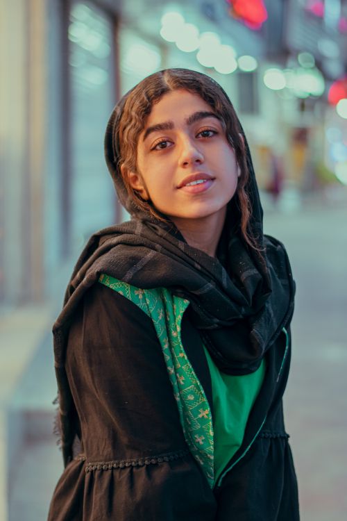 Free Charming portrait of a young woman in Jiroft, Kerman Province, showcasing cultural fashion. Stock Photo
