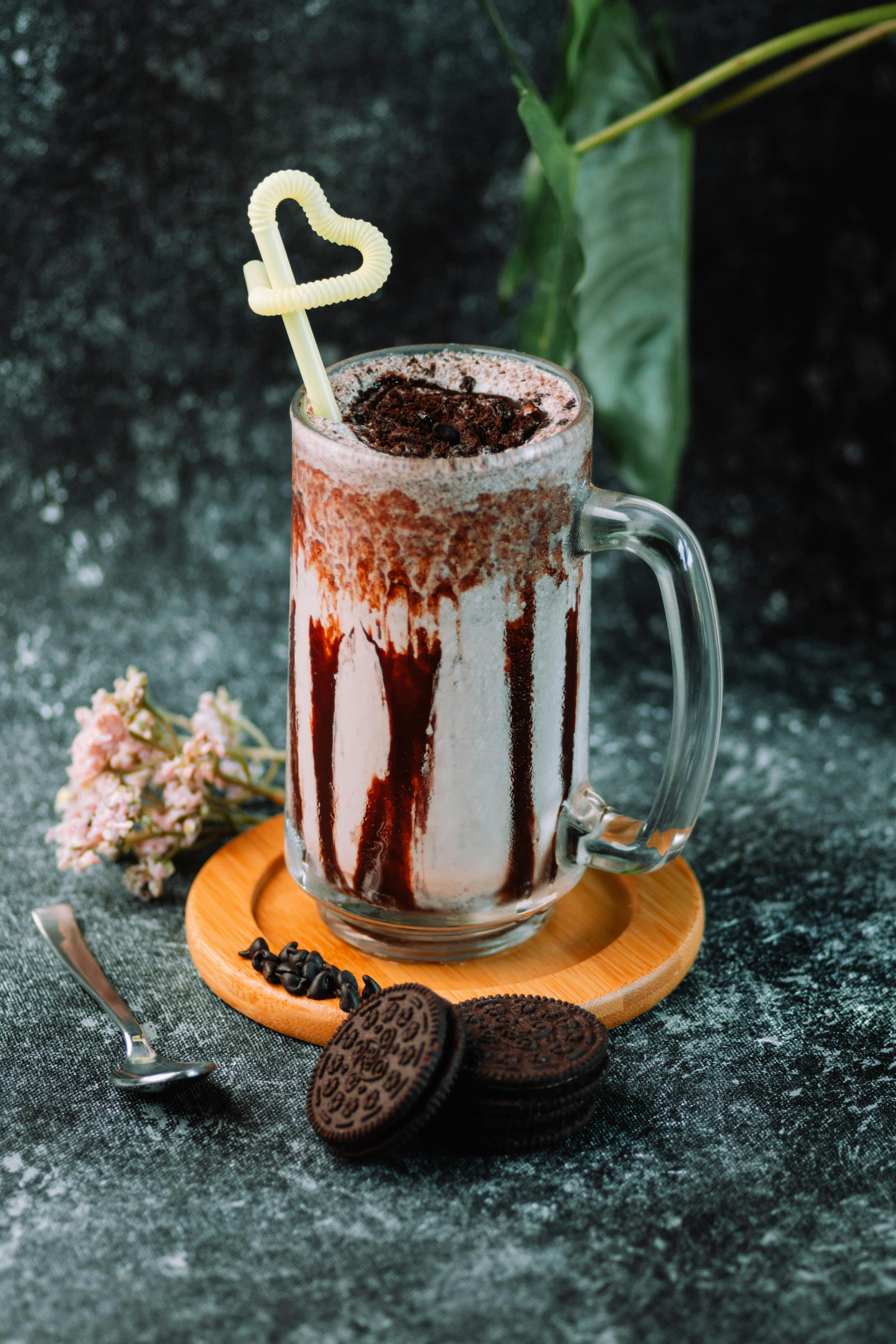 Chocolate milkshake in plastic cup hi-res stock photography and
