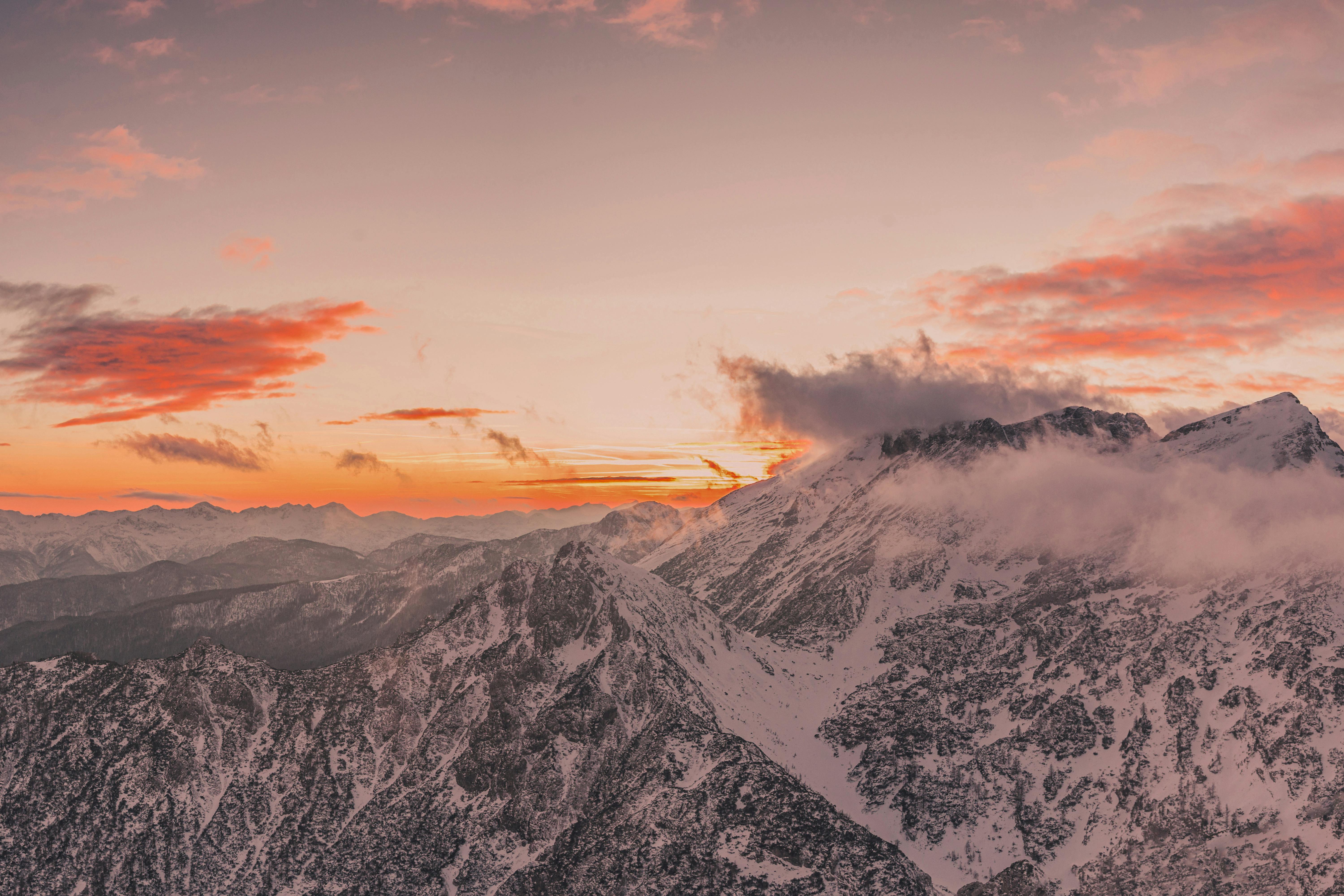 Aerial Photography of SnowCovered Mountains during Sunset · Free Stock
