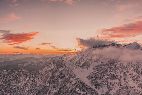 Aerial Photography of Snow-Covered Mountains during Sunset