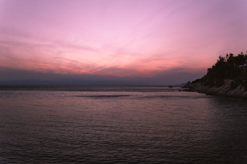 Scenic View of the Sea Under Pink Sky