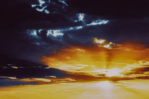 Stunning sunset cloudscape with vibrant colors and dramatic lighting, captured over Pokrovskii, Belarus.