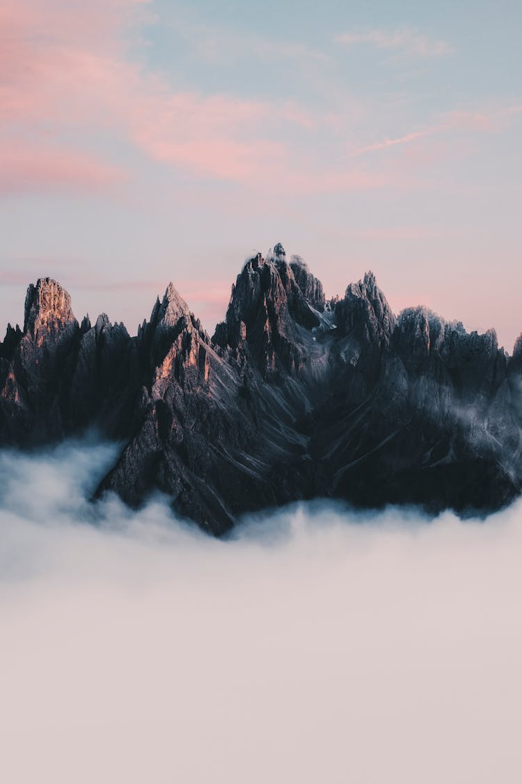 Sharp Mountain Peaks In Clouds