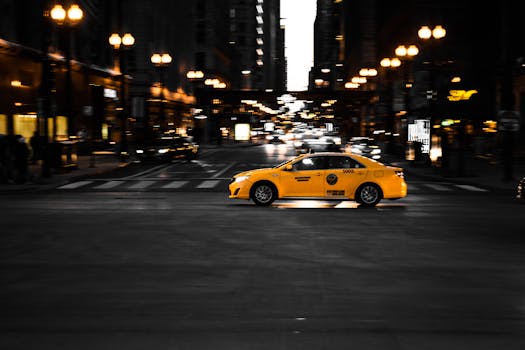 Photography of Yellow Taxi On Road