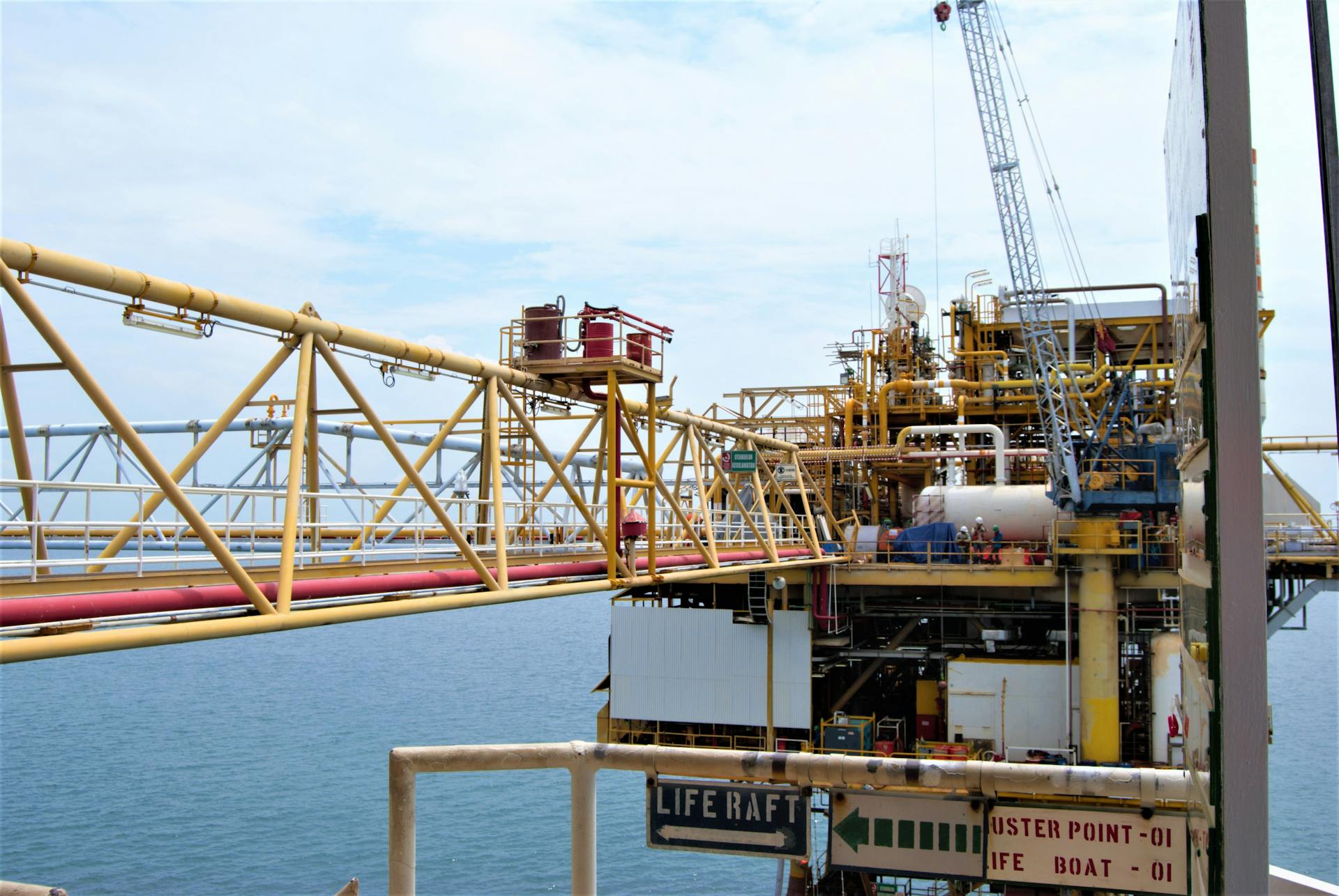 A detailed view of an offshore oil rig in Indonesian waters, highlighting industrial engineering.