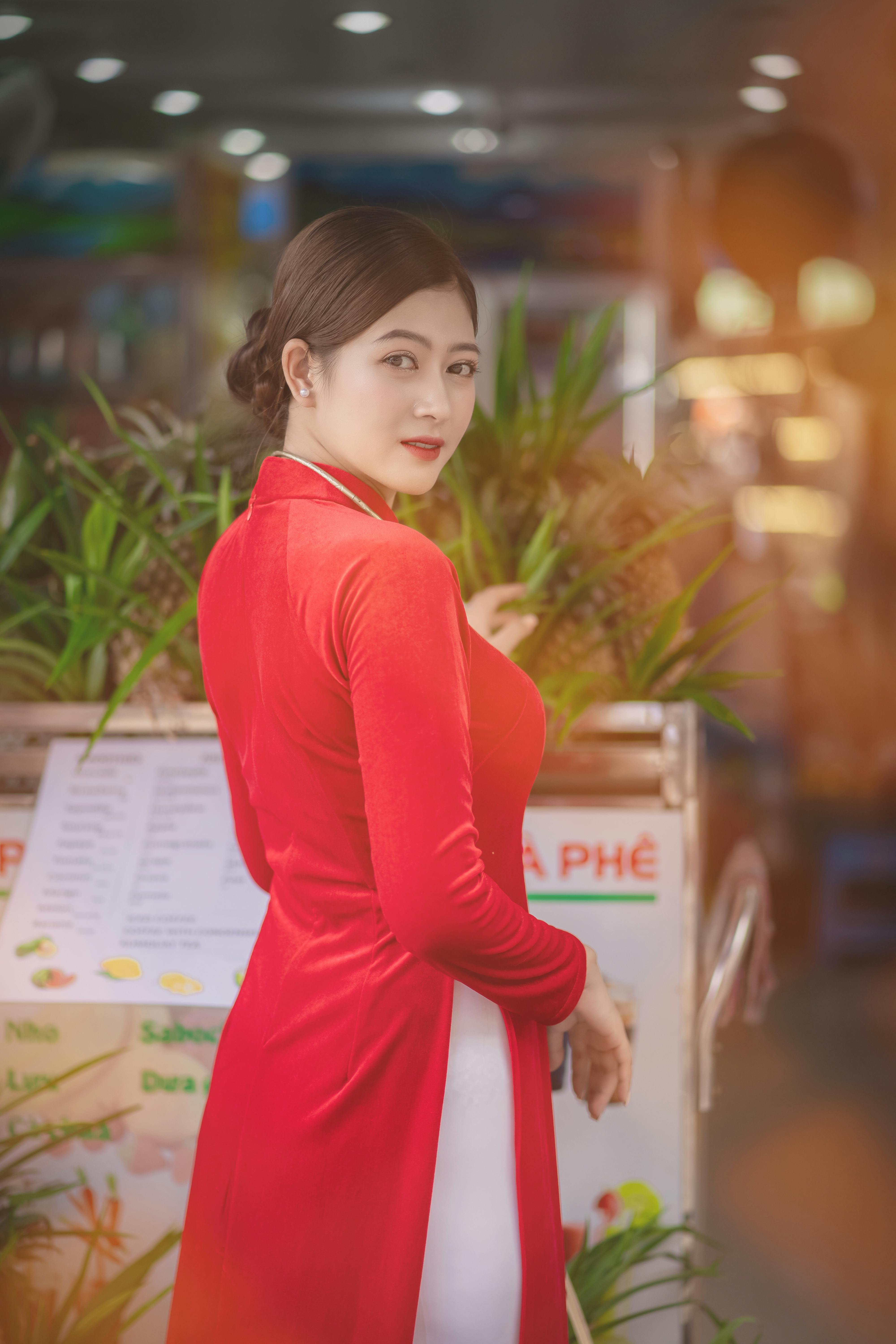 a woman in red long sleeve dress