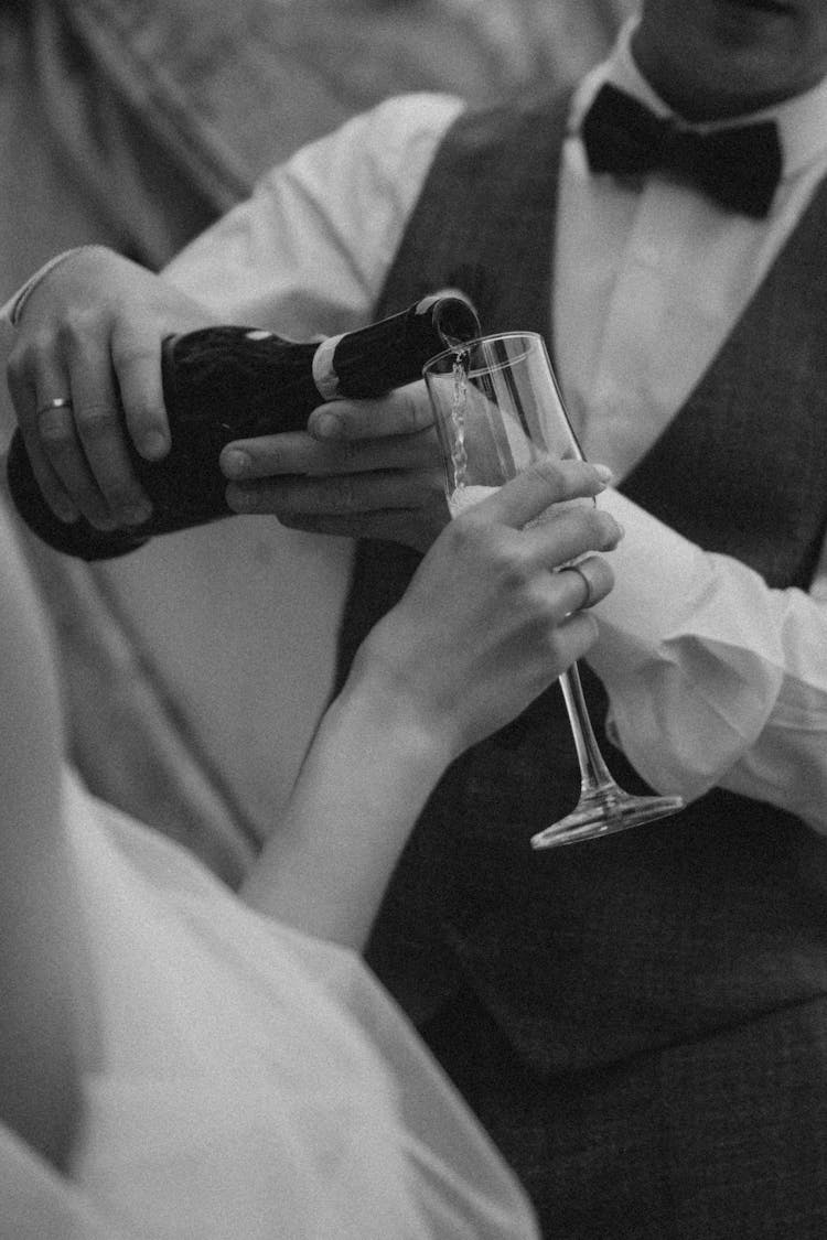 Male Hands Pouring Wine