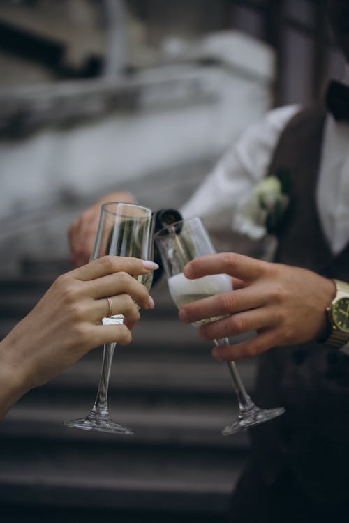 Hands with Wine Glasses