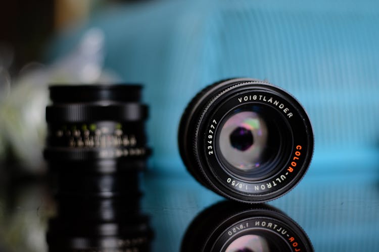 Camera Lenses On Shiny Table