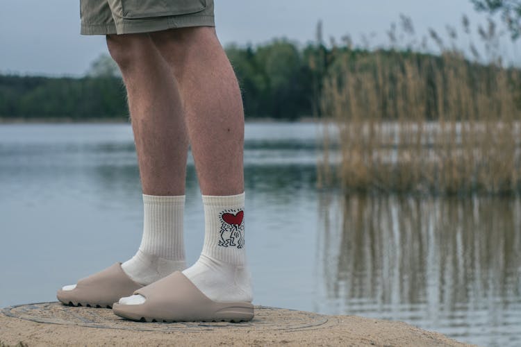 Person Wearing White And Clogs 