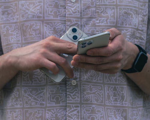 A Person Holding Smartphones