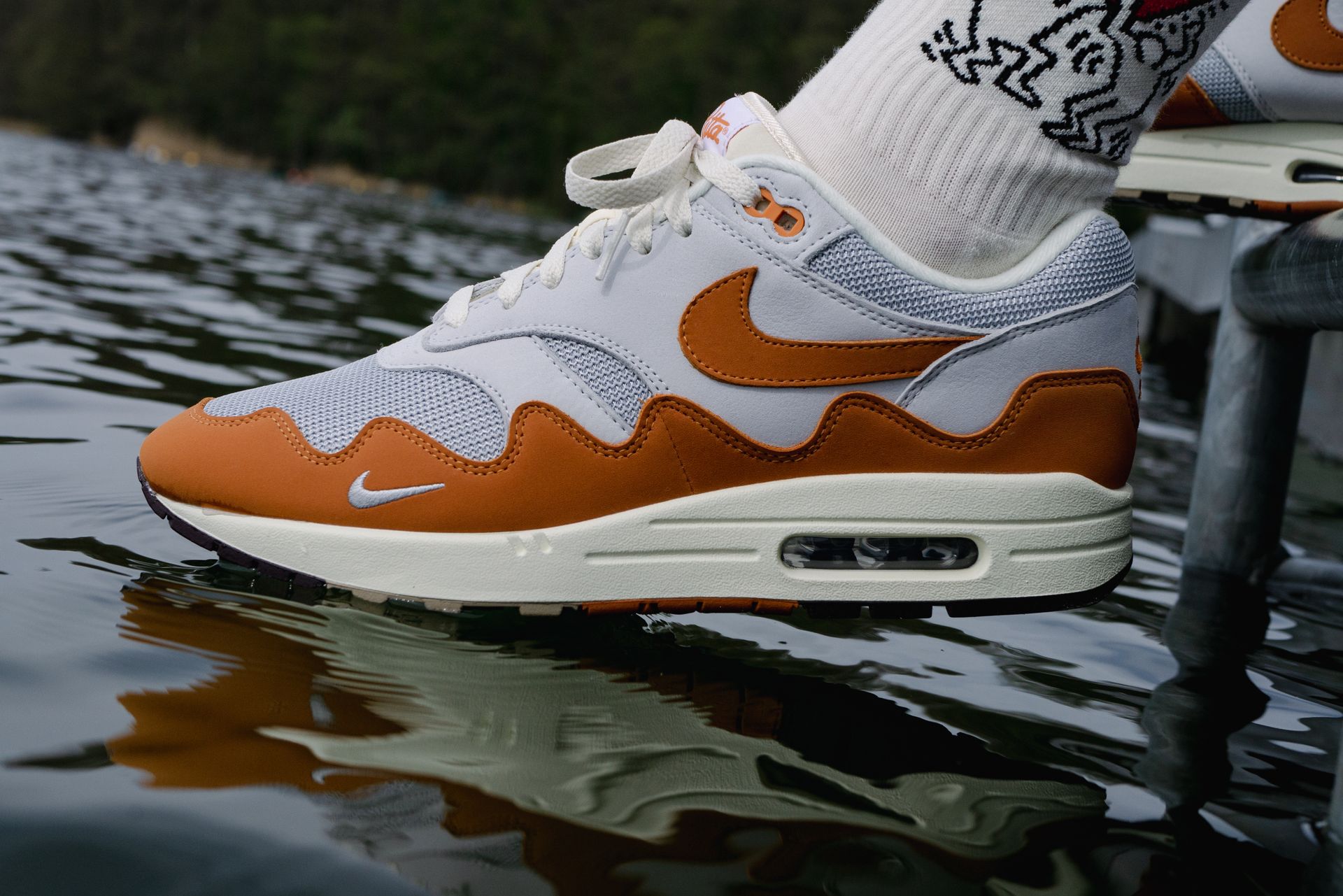 A Person Wearing White and Brown Nike Sneakers