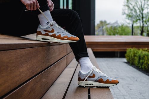 Free Close-up of stylish sneakers worn outdoors, reflecting urban fashion trends. Stock Photo