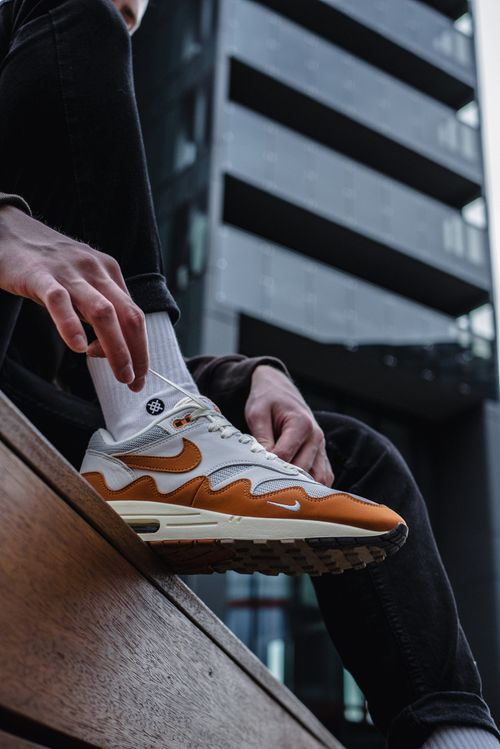 Free Close-up of stylish Nike sneakers in a contemporary urban environment. Stock Photo