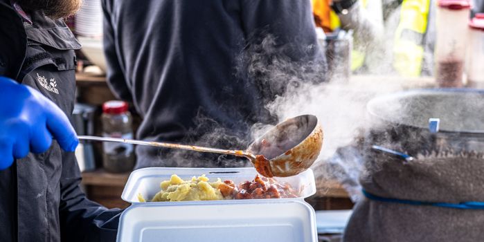 A Person Holding Metal Ladle