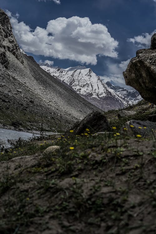 A Snow Covered Mountain Under the Blue Sky and White Clouds