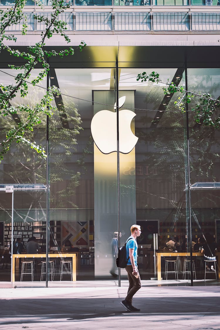 Man Passing An Apple Store